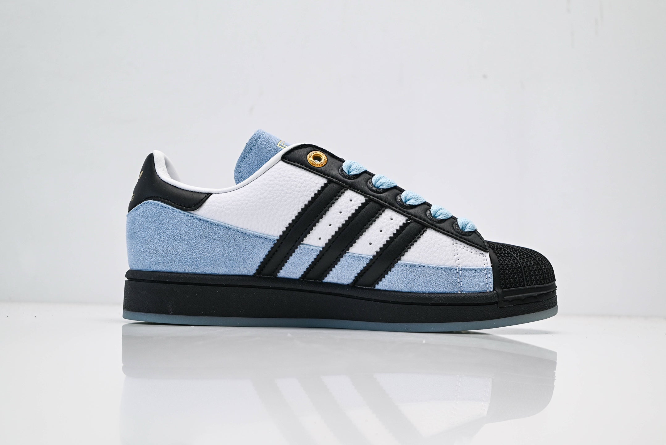 adidas Originals Superstar – Light Blue Upper with White 3-Stripes, Black Heel Tab & Gold Accents